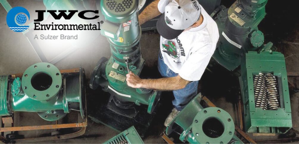 A man is surrounded by grinders and is repairing one.