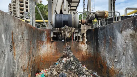 A screening and conveyor system processing solid material
